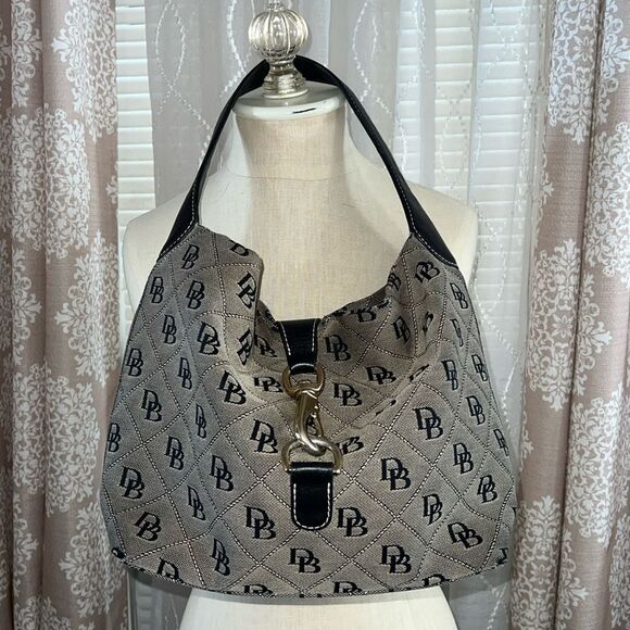 Black and white Dooney and bourke. - Picture 1 of 10